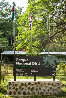 a sign in a park with flags on top of it at Hotel Diriá Santa Cruz in Santa Cruz