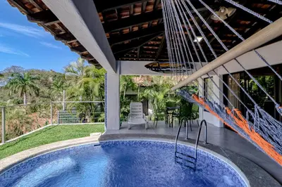a swimming pool in the backyard of a house at Villa Sol 35 in Playa Hermosa