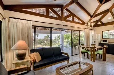 a living room with a couch and a table at Villa Sol 35 in Playa Hermosa