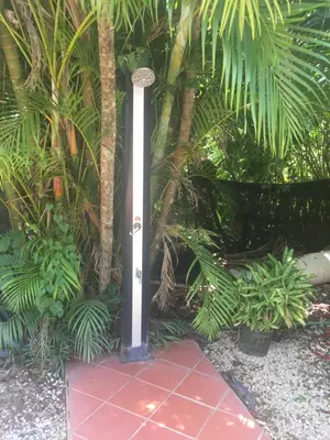 a pole in the middle of a garden with plants at Villas Luna de Miel in Carmen