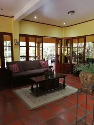 a living room with a couch and a coffee table at Trapp Family Country Inn in San Antonio