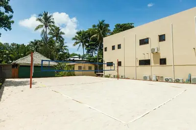 an empty basketball court in front of a building at Boutique Surf Hotel Rip Jack Inn in Playa Grande