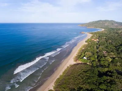 an aerial view of a beach and the ocean at Boutique Surf Hotel Rip Jack Inn in Playa Grande
