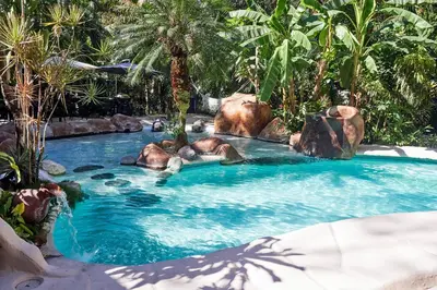 a pool with two bears in the water at Villa Havana in Mal País