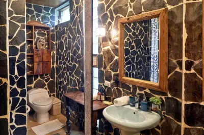 a bathroom with a sink and a toilet at Villa Havana in Mal País