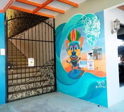 a door with a painting of a lion on it at Domi Cabin in Dominical