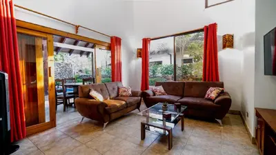 a living room with two couches and a table at Casa tropical - Fabulous tropical house in Tamarindo