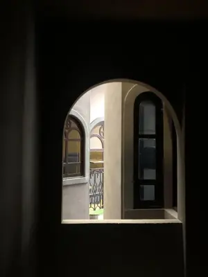 a view of a window of a house at Alajuela Backpackers Airport Hostel in Alajuela City
