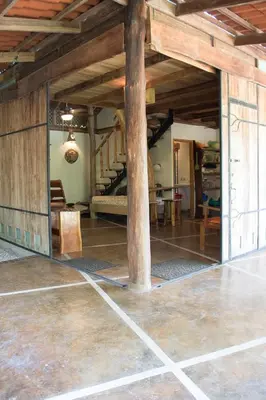 a large room with a staircase in a house at Casita de los Sueños in Cabuya