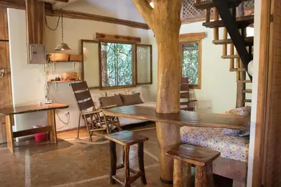 a kitchen and dining room with a table and chairs at Casita de los Sueños in Cabuya