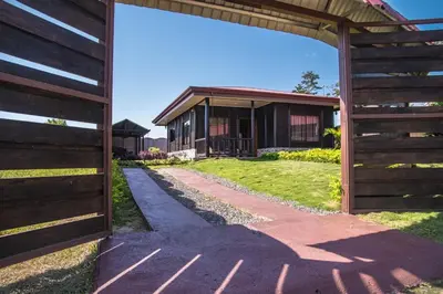 a barn entrance to a house with a yard at Cabaña El Monasterio in Fortuna