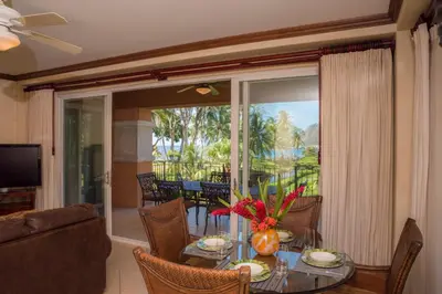 a living room with a table and chairs and a balcony at Bay Residence 7C 3 bdr Ocean View in Los Suenos in Herradura