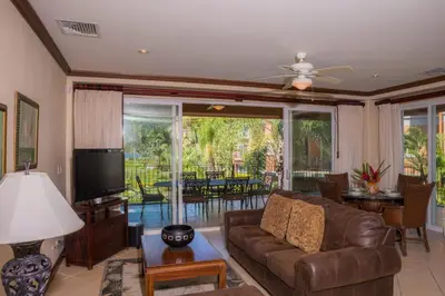 a living room with a couch and a tv at Bay Residence 7C 3 bdr Ocean View in Los Suenos in Herradura
