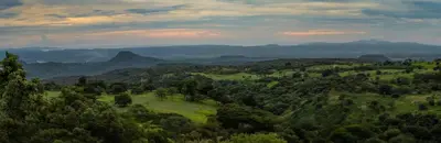 an aerial view of a valley with trees and mountains at Buena Vista del Rincón Eco Adventure Park Hotel & Spa in Liberia