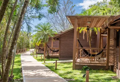 a resort with a hammock and a playground at Buena Vista del Rincón Eco Adventure Park Hotel & Spa in Liberia