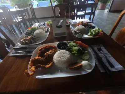 a table with three plates of food on it at Cabinas Sueño Real in San Rafael