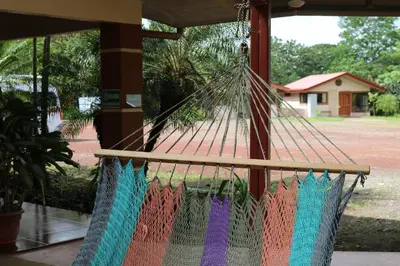a hammock with colored threads hanging from it at Cabinas Sueño Real in San Rafael