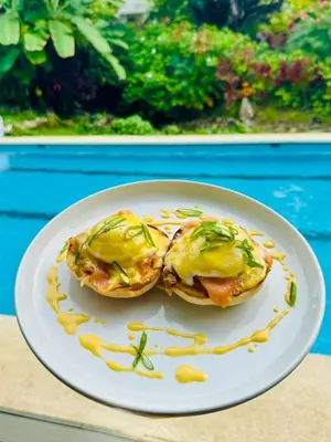 a white plate with two food dishes on it at Aves Resort Montezuma in Montezuma