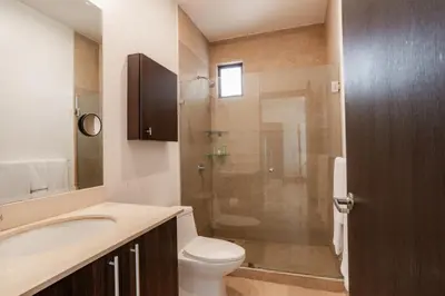 a bathroom with a toilet and a sink and a shower at Adults Only 1BR Condo - Roble Sabana - Reserva Conchal Golf Resort in Playa Conchal