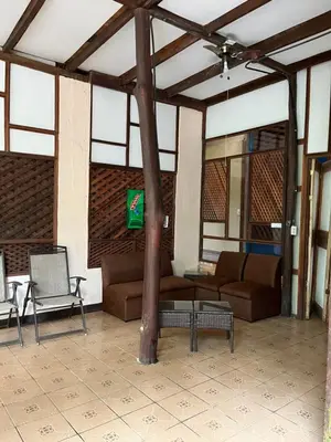 a living room with a couch and a table at Chilamate Rainforest Eco Retreat in Puerto Viejo