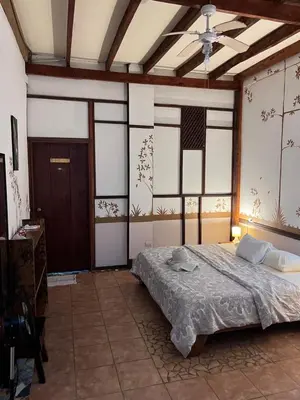 a bedroom with a bed and a ceiling at Chilamate Rainforest Eco Retreat in Puerto Viejo