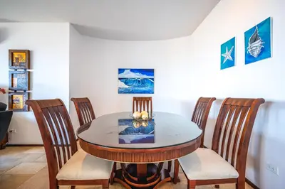 a dining room with a table and four chairs at Corona del Mar #6 in Ocotal