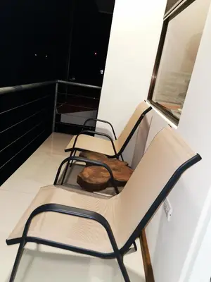 two chairs sitting on top of a balcony at CASA GERANIOS STUDIO #3 in Monteverde Costa Rica