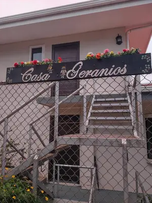 a sign that says bosnia and herzegonia on a fence at CASA GERANIOS STUDIO #3 in Monteverde Costa Rica