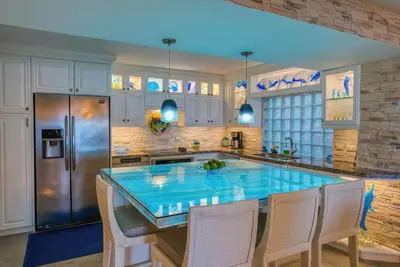 a kitchen with a large blue island in the middle at Bahia Pez Vela Resort in Ocotal