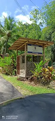 a kiosk with a sign on the side of a road at Selva Linda Lodge jungle wildlife vue and birdwatching in Quepos