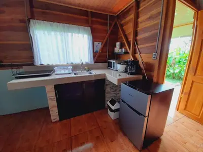 a kitchen with a sink and a counter top at Cabaña Rural Ave del Paraíso in Fortuna