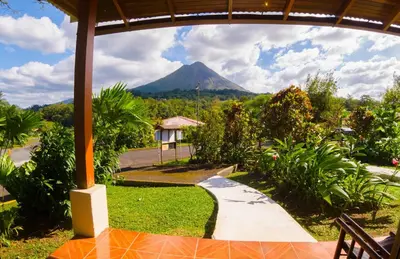 a view of a mountain from a house at Arenal Paraiso Resort Spa & Thermo Mineral Hot Springs in Fortuna
