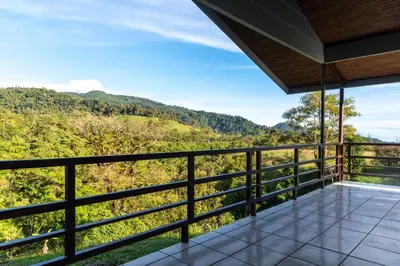 a balcony with a view of the mountains at Calas Lodge in Bajos del Toro