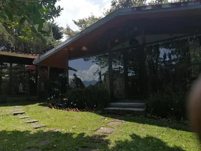 a house with a window with a view of a mountain at Suite y Loft Casa Toría in San Isidro