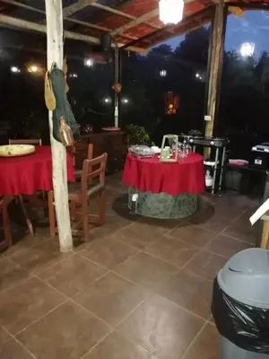 a dining room with two tables with red table cloth at Suite y Loft Casa Toría in San Isidro