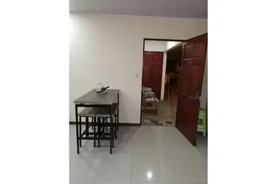 a view of a room with a table and a kitchen at Aptos Casa Caribe, habitaciones privadas en aptos compartidos & aptos completos con auto entrada in Puerto Limón