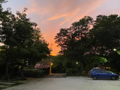 a car parked in a parking lot at sunset at Casas del Toro Playa Flamingo in Playa Flamingo