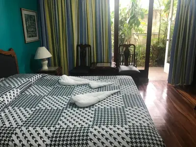 two white towels on a bed in a room at La Bergerac Boutique Hotel in San José
