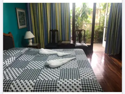 two white pillows on a bed in a room at La Bergerac Boutique Hotel in San José