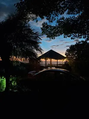 a car parked in front of a gazebo at dusk at Bella Vista Lodge in Monteverde Costa Rica