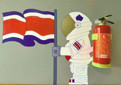 a painting of a robot next to a fire extinguisher at Moon Wonders Vacation House in Monteverde Costa Rica