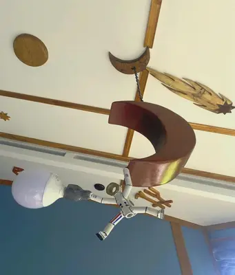 a fan hanging from a ceiling in a room at Moon Wonders Vacation House in Monteverde Costa Rica