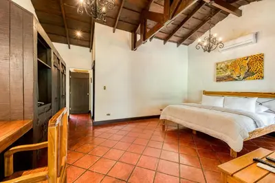 a bedroom with a large bed in a room at Hacienda La Pacífica Eco-Lodge in Cañas
