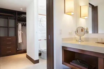 a bathroom with a sink and a toilet and a mirror at El Mangroove Papagayo, Autograph Collection in Papagayo, Guanacaste