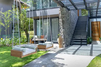 a swing in the yard of a house at El Mangroove Papagayo, Autograph Collection in Papagayo, Guanacaste