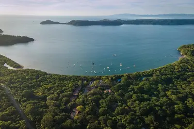 an aerial view of a lake with boats in the water at El Mangroove Papagayo, Autograph Collection in Papagayo, Guanacaste