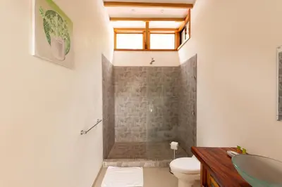 a bathroom with a toilet and a sink at Villa Akari - Brand new 2bedrooms Villa with Pool in Carmen