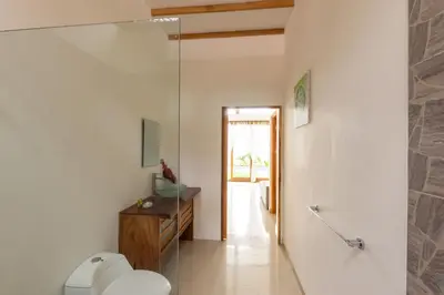 a bathroom with a toilet and a walk in shower at Villa Akari - Brand new 2bedrooms Villa with Pool in Carmen