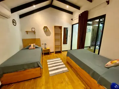 a bedroom with two beds in a room at Santeria Lodge in Santa Teresa Beach