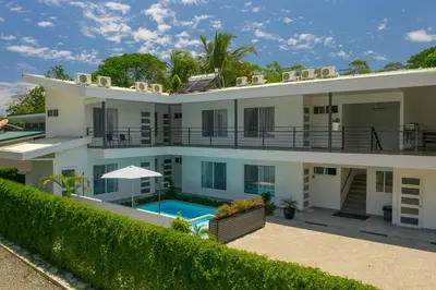 an aerial view of a house with a swimming pool at HOTEL MARINO BALLENA in Uvita